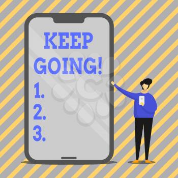 Writing note showing Keep Going. Business concept for make effort to live normally in spite of difficulty situation Man Presenting Huge Smartphone while Holding Another Mobile