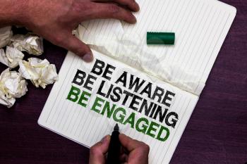Text sign showing Be Aware Be Listening Be Engaged. Conceptual photo take attention to actions or speakers Man holding marker notebook page crumpled papers several tries mistakes