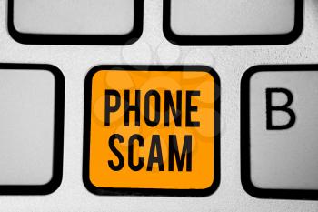 Text sign showing Phone Scam. Conceptual photo getting unwanted calls to promote products or service Telesales Keyboard orange key Intention create computer computing reflection document