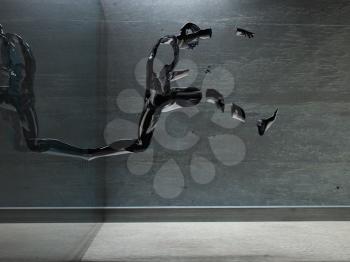 3d render. Figure of man made of metal in motion.
