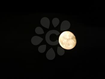 Full moon at night in the city shining bright