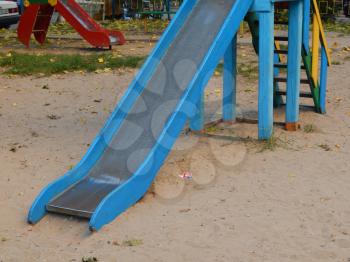 Children playground, swing near the house