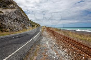 Empty road and railway track in New Zealand
