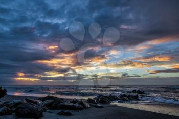 Sunset at Hokitika beach in New Zealand