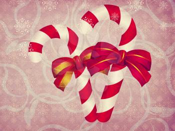 Illustration of two candy canes with bows on retro background.