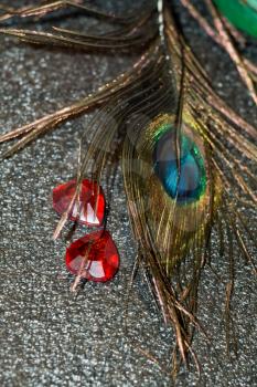 Close up image of a peacock feather as background.