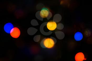 Defocused Christmas tree lights, colorful bokeh background.