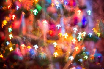 Festive background with bird shaped bokeh from Christmas tree lights glowing. 