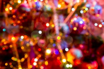 Festive background with bokeh from Christmas tree lights glowing. 