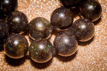 Round beaded bracelet made of natural black opal stone.