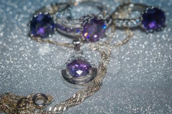 Fashion silver pendant with purple zirconia, amethyst imitation.