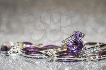 Fashion silver ring decorated with natural amethyst gemstone.