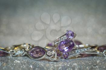 Fashion silver ring decorated with natural amethyst gemstone.