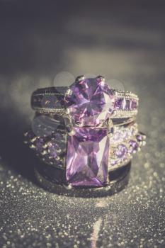 Fashion silver ring with purple zirconia, amethyst imitation, filtered.