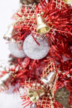 Small red Christmas tree on white snow background.