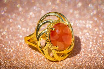 Fashion yellow gold ring decorated with red onyx stone.