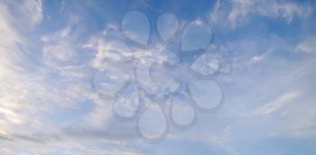 Blue summer sky with white clouds, natural background.