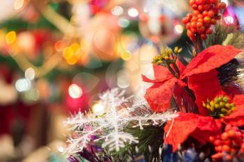 Holiday background with decorations on Christmas tree.