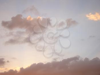 Photo of summer sky with clouds at sunset time.