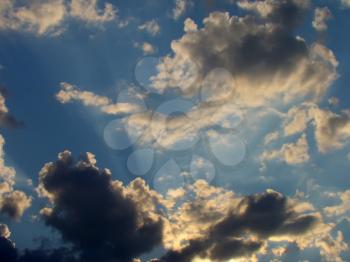 Photo of summer sky with clouds at sunset time.