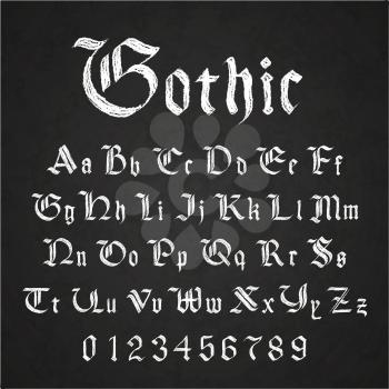 Set of old hand drawn gothic letters drawing with white chalk on black chalkboard