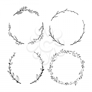 Set of cute detailed hand drawn floral wreaths on white