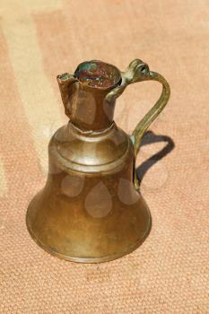 Ancient metal jug in oriental style  in antique market