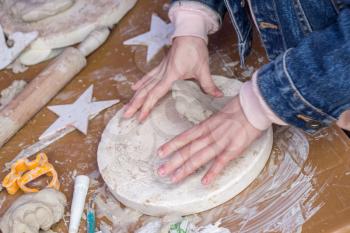 Hands holding Play Dough as Concept of sensetive education and therapy