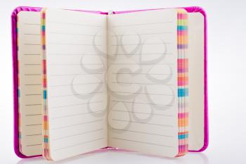 Pink notebook on a white background