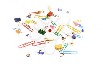 colurful paperclips scattered around on a white background