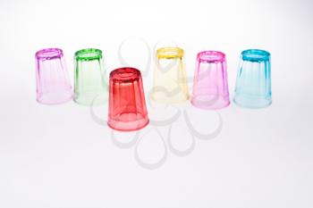 Colorful drinking glass on white background