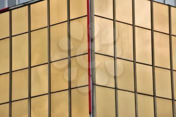 Glass windows facade of a modern office building. Architectural detail.