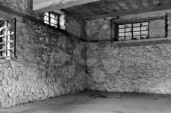 Empty industrial room and textured white wall. Abandoned warehouse interior.