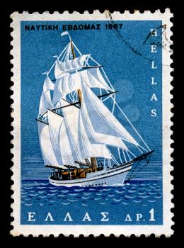 GREECE - CIRCA 1967. Vintage postage stamp printed by the Hellenic Post for the Nautical Week shows sailboat at open sea illustration, circa 1967.