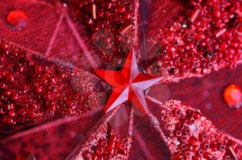 Christmas seasonal background with red star and glitter.