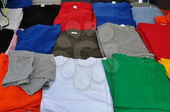 Colorful short sleeve t-shirts background. Casual summer clothes.