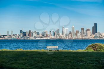 A view of the Seattle skyline with a bench.