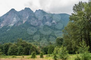 Clouds touch the top of Mount Si in Washington State.