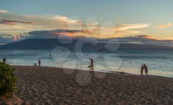 Aview of Lanai from a beech in Maui, Hawaii. The sun has set.