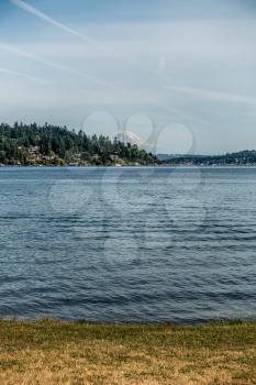 Mount Rainier can be seen in the distance with Lake Washington  in the foregrund. Mercer Island is on the left. Shot taken at Seward Park.