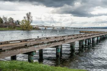 A view of a pier on Lake Washington in Seattle. Highway I-90 bridge in the distance.