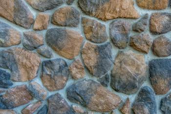 Closeup image of a free form rock wall.  Background or texture
