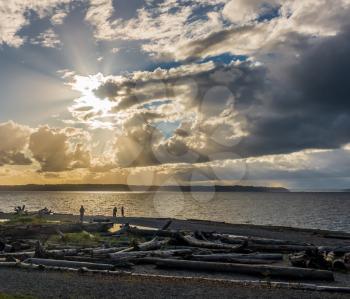 Clouds obscure the sun creating rays of light over the Puget Sound.