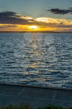 A view of a golden sunset  across the Puget Sound from West Seattle, Washington.