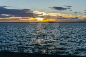 A view of a golden sunset  across the Puget Sound from West Seattle, Washington.