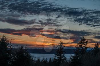 A view of a sunset from Three Tree Point in Burien, Washington.