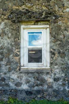 A view of windows of the  old church at Keanae Point on Maui, Hawaii.