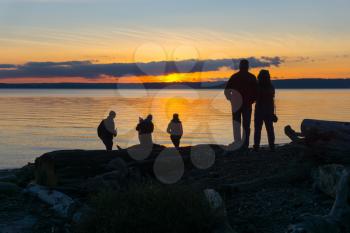 People watch the sunset from Normandy Park, Washington.