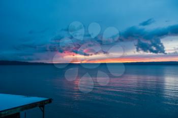 The sun sets behind the Puget Sound in winter.