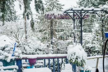A view of a front porch that is covered with snow in Burien, Washington.